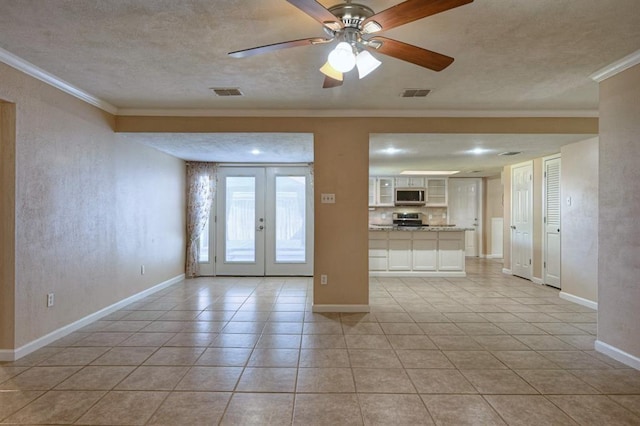 unfurnished living room featuring visible vents, crown molding, and french doors