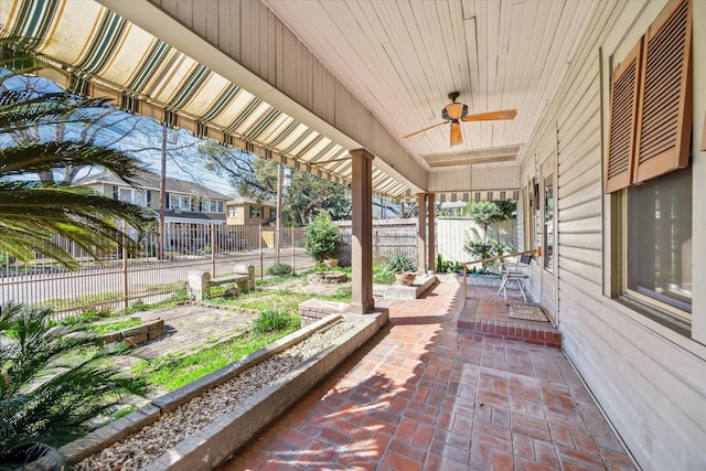 view of patio / terrace with fence and ceiling fan