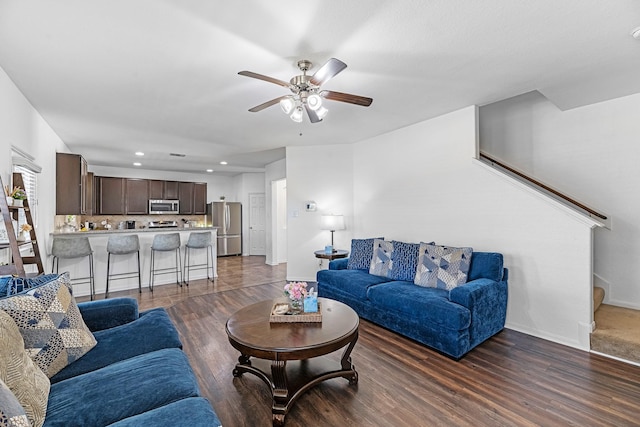 living area with recessed lighting, baseboards, dark wood-type flooring, and a ceiling fan