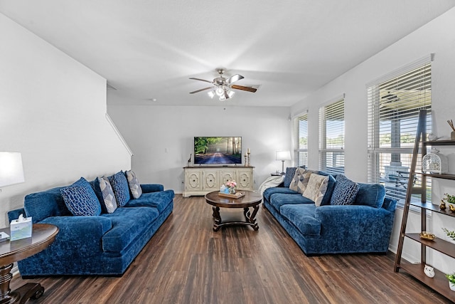 living room with baseboards, wood finished floors, and a ceiling fan