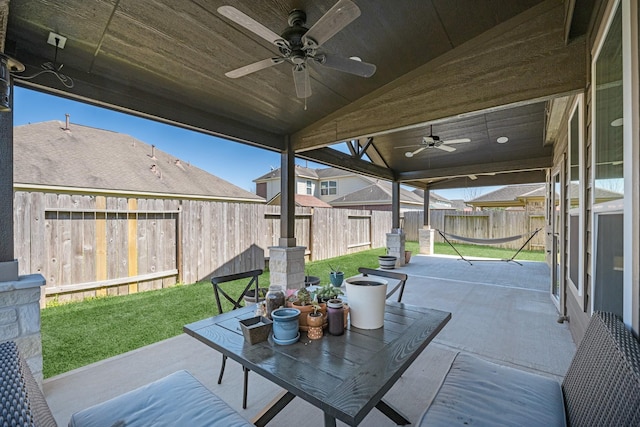 view of patio featuring a fenced backyard and ceiling fan