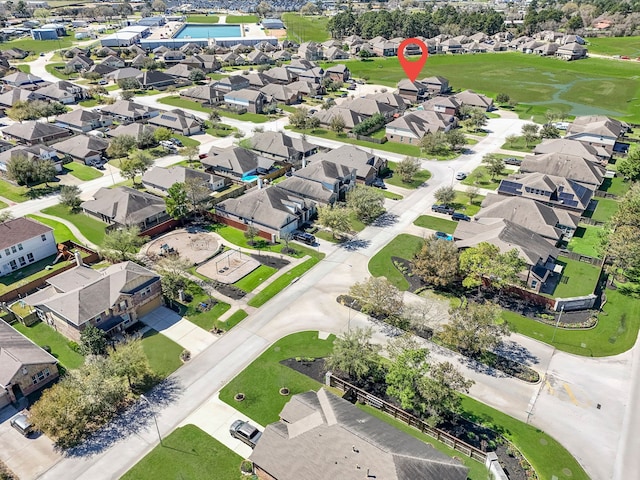 birds eye view of property with a residential view