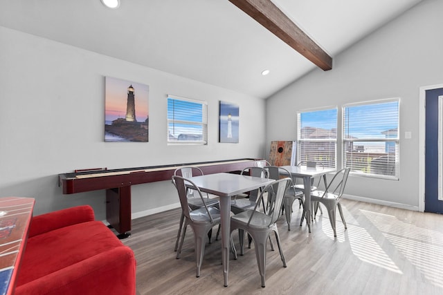 dining area featuring light wood finished floors, recessed lighting, lofted ceiling with beams, and baseboards