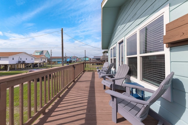 wooden deck featuring a residential view