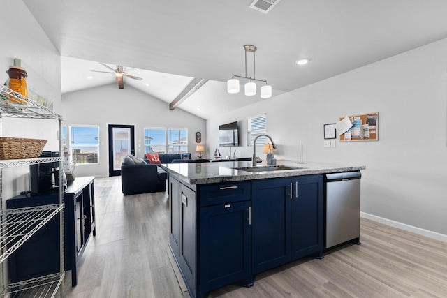 kitchen featuring a healthy amount of sunlight, light wood finished floors, ceiling fan, a sink, and stainless steel dishwasher