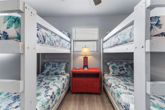 bedroom with light wood-style flooring and a ceiling fan