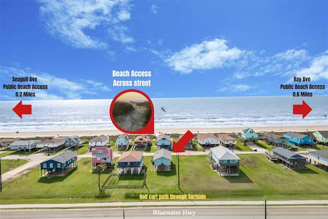 bird's eye view featuring a residential view, a beach view, and a water view