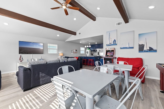 dining area with a ceiling fan, visible vents, baseboards, lofted ceiling with beams, and light wood-style floors