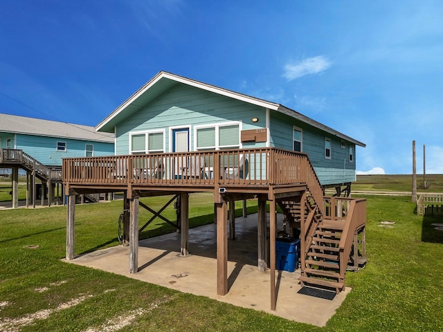 rear view of property featuring a yard, stairs, a carport, a deck, and a patio area