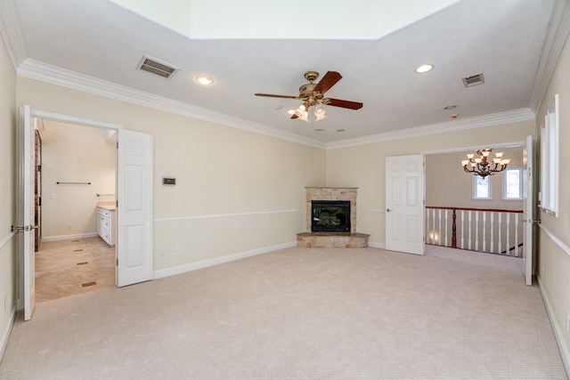 unfurnished living room with visible vents, light colored carpet, ornamental molding, and ceiling fan with notable chandelier