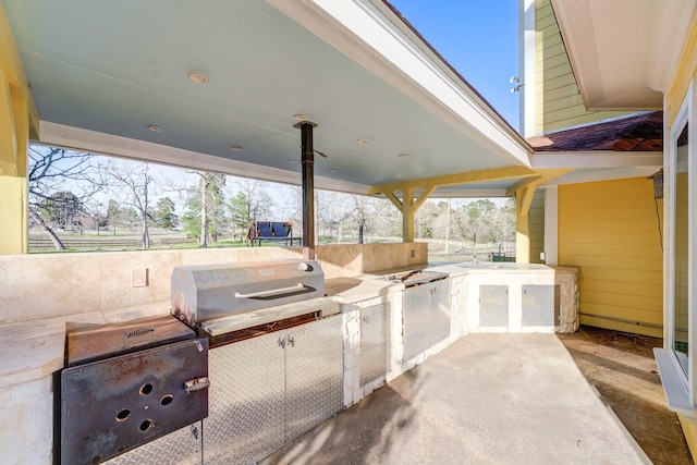 view of patio featuring area for grilling and an outdoor kitchen