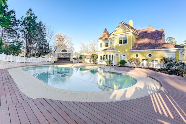 view of pool featuring a fenced in pool, fence private yard, a fireplace, and a patio area