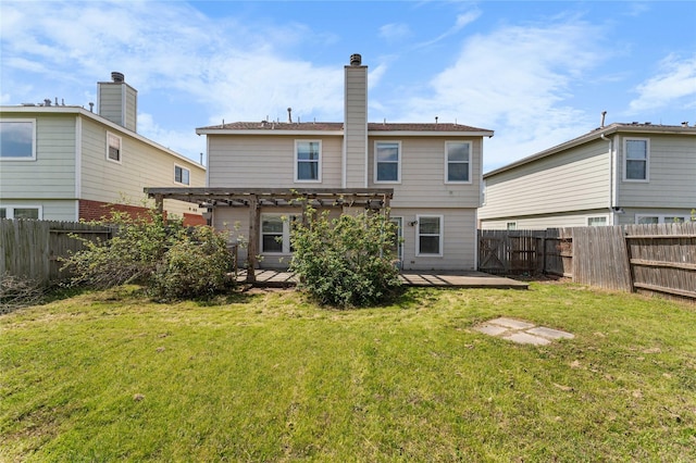 rear view of property with a yard, a fenced backyard, and a pergola