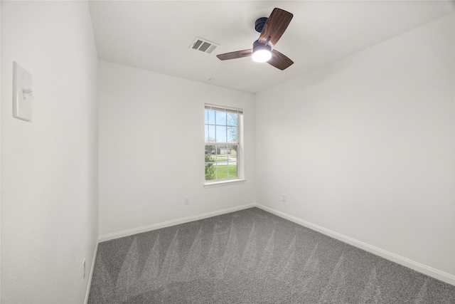 spare room featuring a ceiling fan, carpet, visible vents, and baseboards