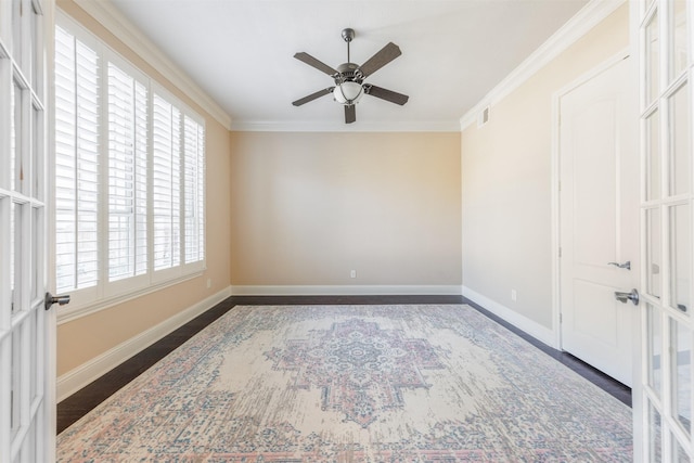 unfurnished room featuring visible vents, baseboards, ceiling fan, and crown molding