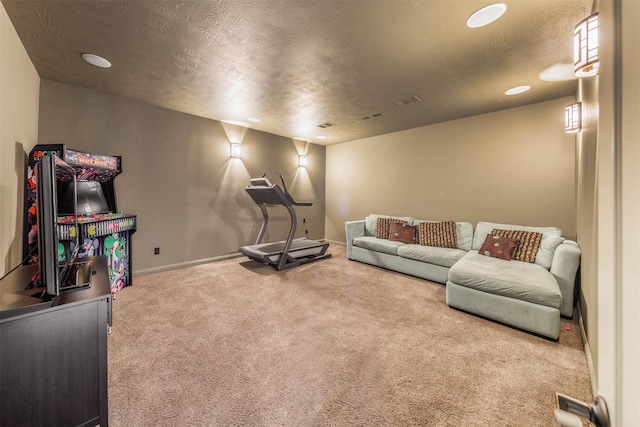 living room featuring visible vents, a textured ceiling, baseboards, and carpet floors