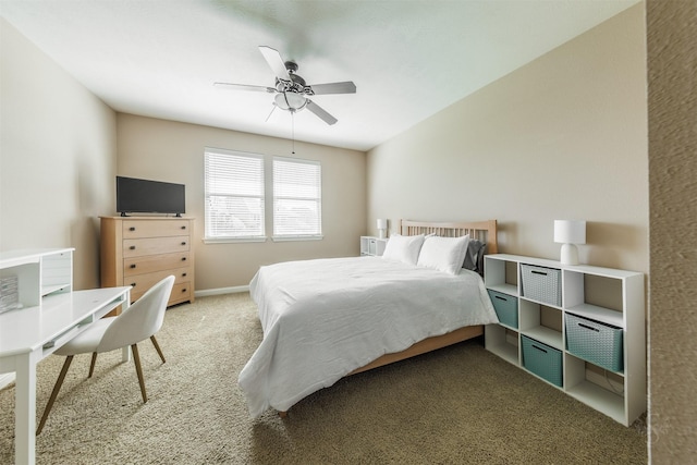 carpeted bedroom with baseboards and ceiling fan