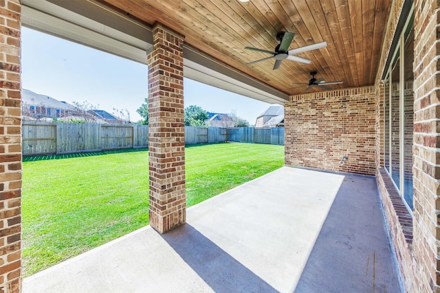 view of patio with a fenced backyard and ceiling fan