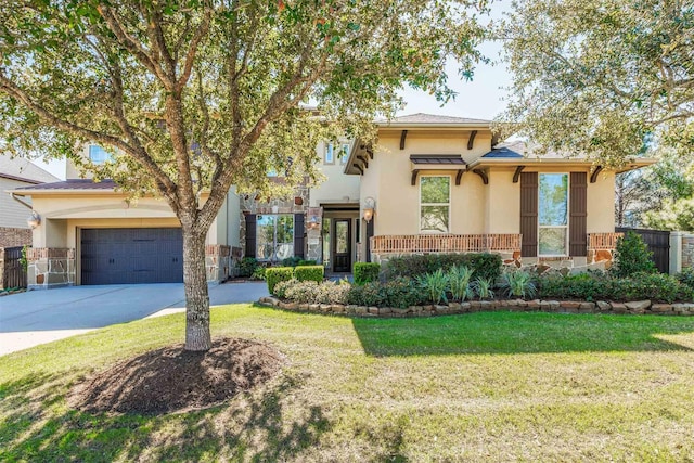 view of front of home with a front lawn, concrete driveway, stucco siding, a garage, and stone siding