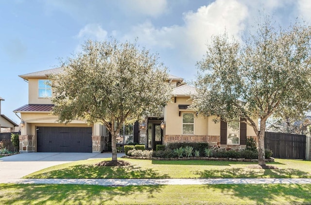 view of front of home featuring fence, concrete driveway, stucco siding, a garage, and stone siding