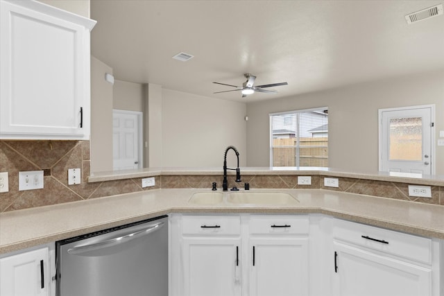 kitchen featuring a sink, visible vents, stainless steel dishwasher, and decorative backsplash