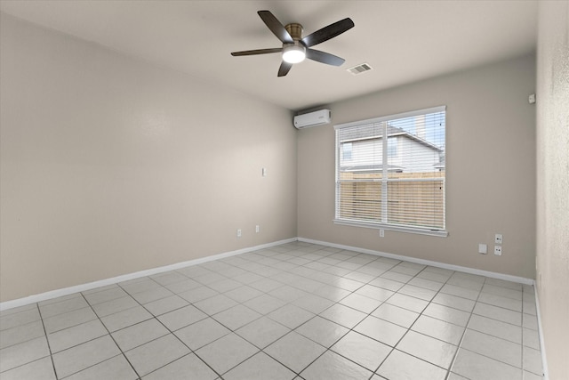 unfurnished room featuring baseboards, visible vents, a wall mounted air conditioner, and a ceiling fan