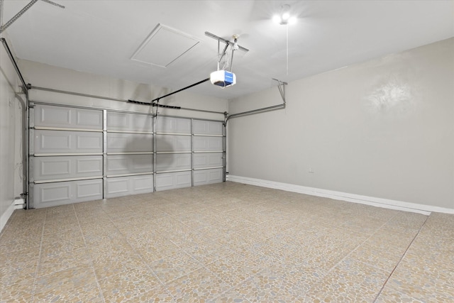 garage with baseboards and a garage door opener