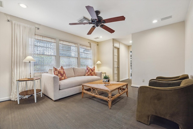 living area with recessed lighting, visible vents, baseboards, and a ceiling fan