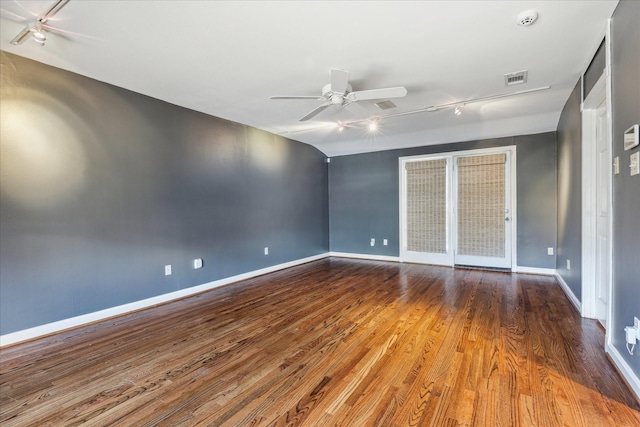 unfurnished bedroom with visible vents, ceiling fan, baseboards, and wood finished floors