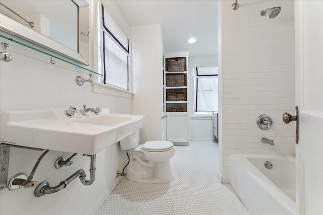 full bath with tile patterned floors, toilet, a sink, shower / washtub combination, and recessed lighting