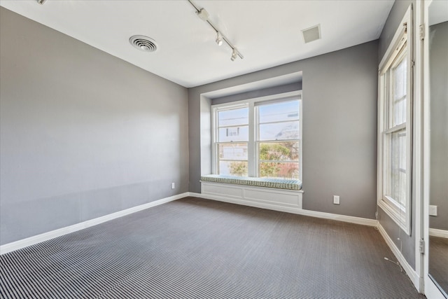 1802 Lexington St, Houston, TX 77098 - unfurnished room with track lighting and dark carpet