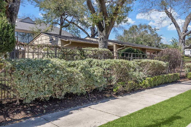 view of home's exterior with fence