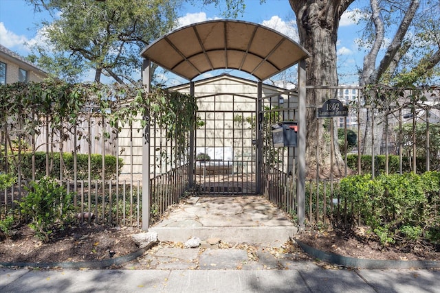 view of gate with fence