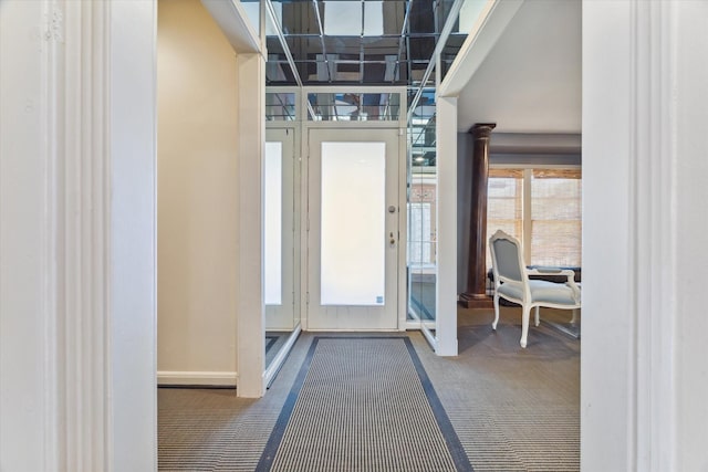 view of carpeted entrance foyer