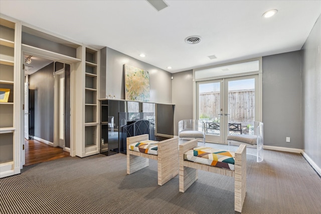 carpeted living room featuring recessed lighting, french doors, baseboards, and visible vents