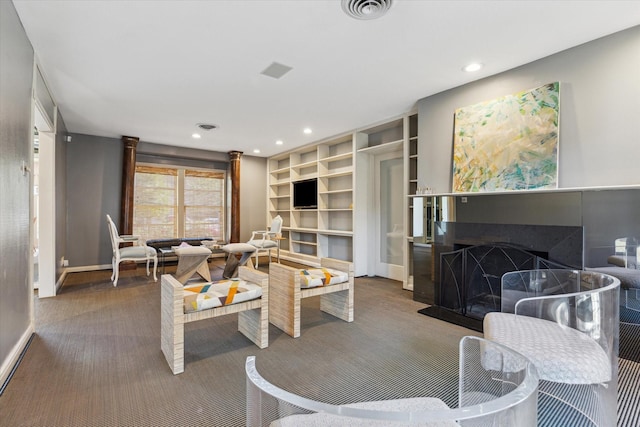 carpeted living room with a fireplace, recessed lighting, visible vents, and baseboards