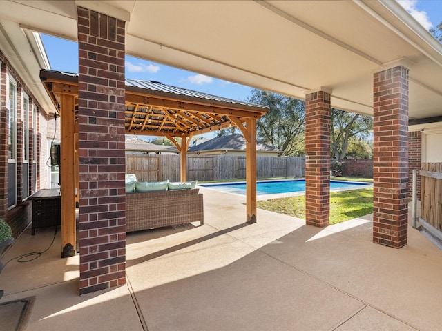 view of patio / terrace featuring a gazebo, a fenced in pool, and a fenced backyard