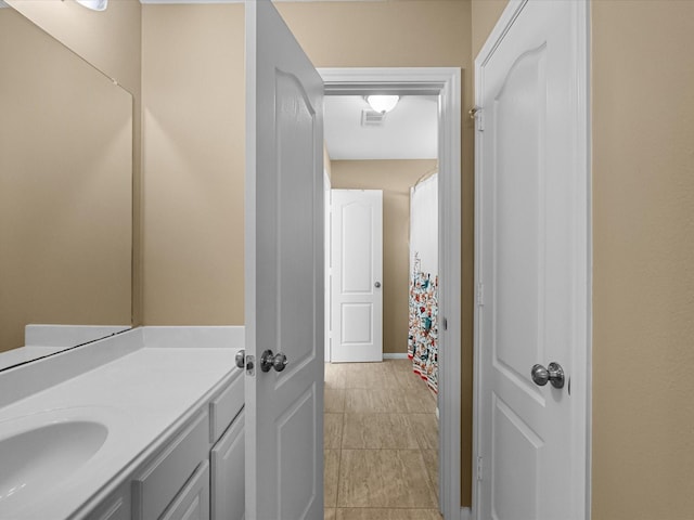 bathroom featuring visible vents and vanity