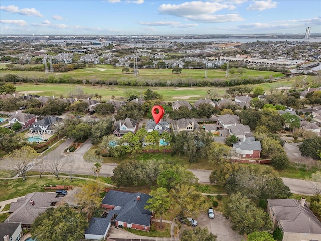 drone / aerial view featuring golf course view and a residential view