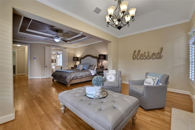 2814 S Cotswold Manor Dr, Kingwood, TX 77339 - bedroom with crown molding, baseboards, light wood-type flooring, a tray ceiling, and an inviting chandelier
