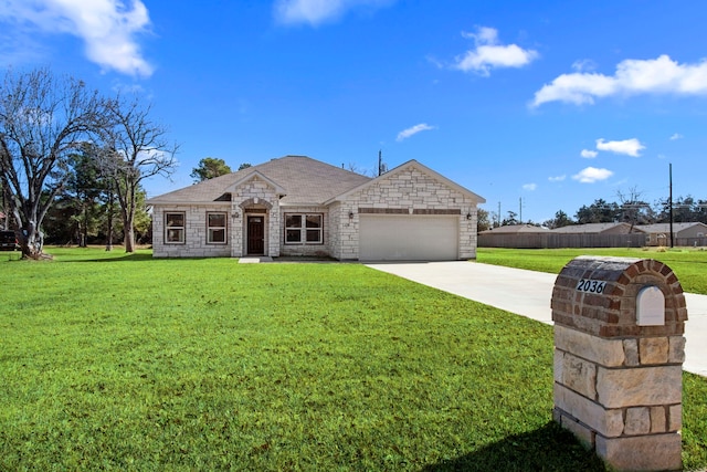 french country inspired facade featuring stone siding, a front lawn, concrete driveway, and a garage