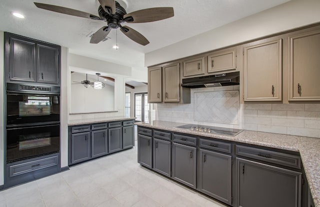 kitchen featuring under cabinet range hood, tasteful backsplash, black appliances, and ceiling fan