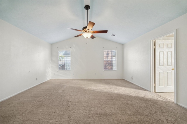 unfurnished room featuring light carpet, plenty of natural light, and ceiling fan