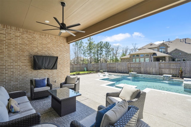 view of patio / terrace featuring a fenced in pool, outdoor lounge area, a fenced backyard, and a ceiling fan