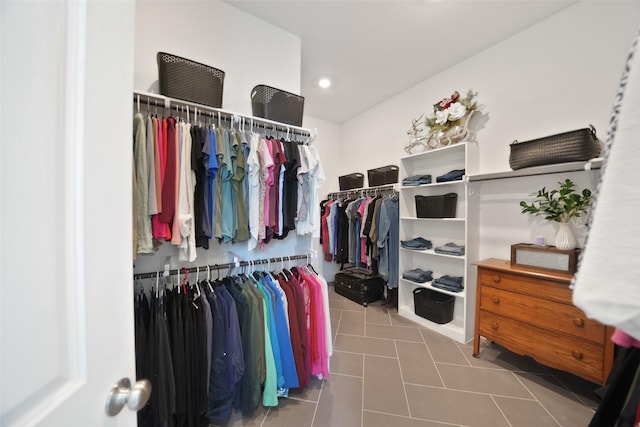 walk in closet with tile patterned flooring