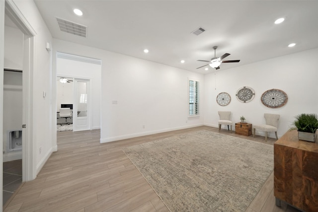 sitting room with light wood-type flooring, visible vents, ceiling fan, and recessed lighting