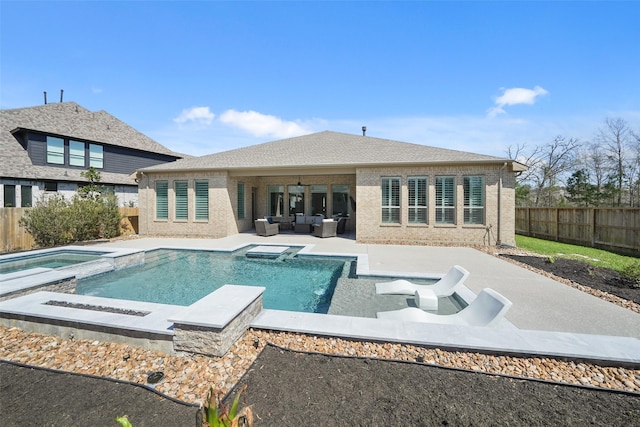 view of pool with a patio, a fenced in pool, an in ground hot tub, an outdoor living space, and a fenced backyard