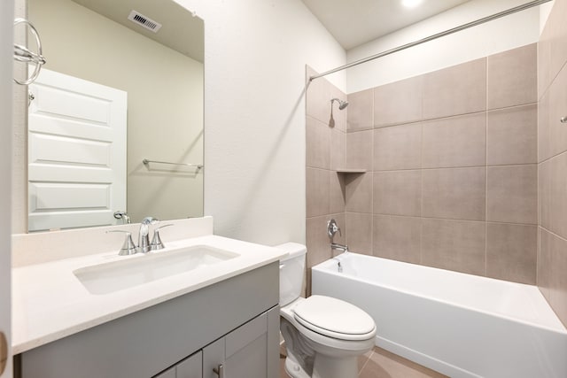 bathroom featuring visible vents, toilet,  shower combination, and vanity