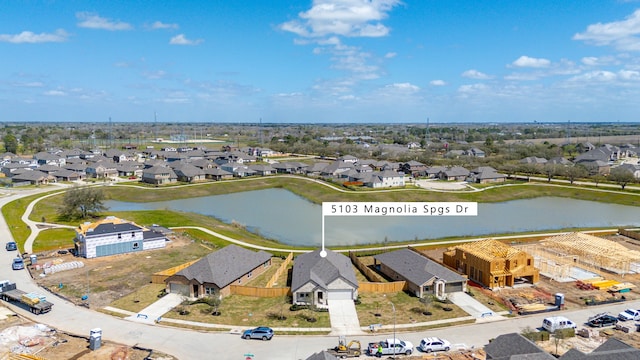 bird's eye view featuring a residential view and a water view