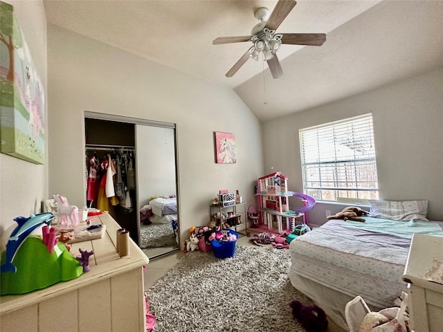 bedroom with a closet, a ceiling fan, and lofted ceiling